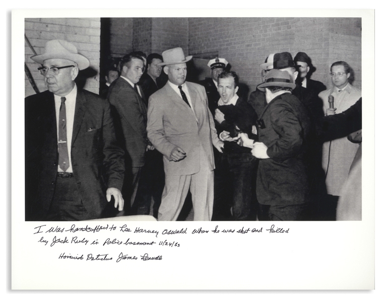 James Leavelle Signed 14'' x 11'' Photo of Jack Ruby Shooting Lee Harvey Oswald, as Leavelle Was Handcuffed to Oswald -- With a Handwritten Statement by Leavelle Concerning the Event